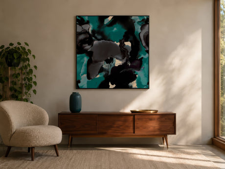 Navy, teal, and gold abstract canvas with metallic texture, framed above a walnut console in a modern living room.