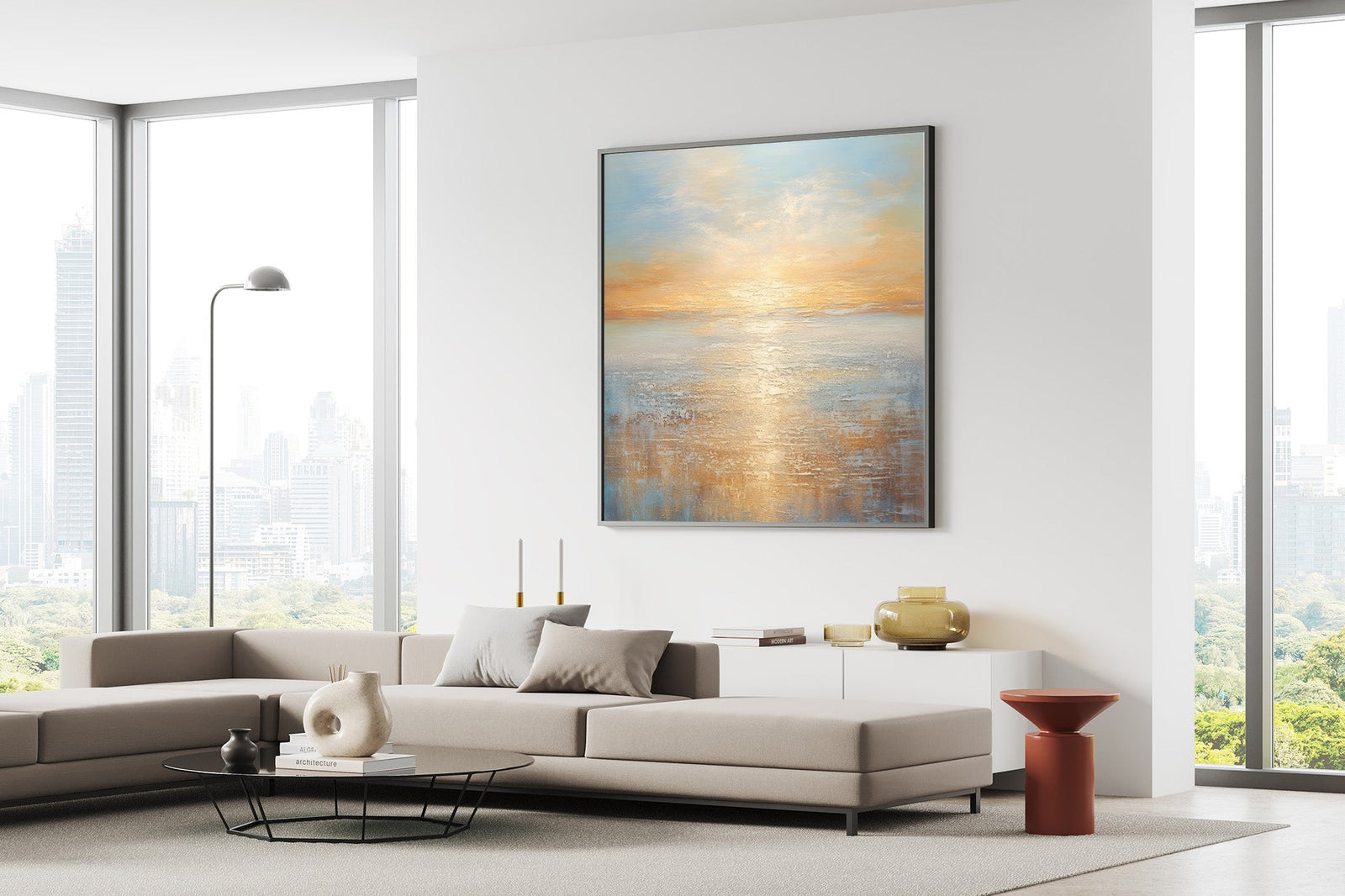 Framed large landscape wall art above a modern beige sofa with city view