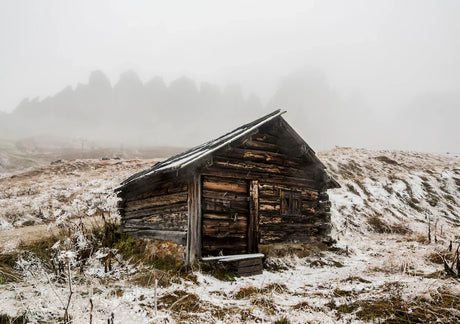 Winter scene wall art from Adelaide collection featuring a snow-covered log cabin and freezing mist