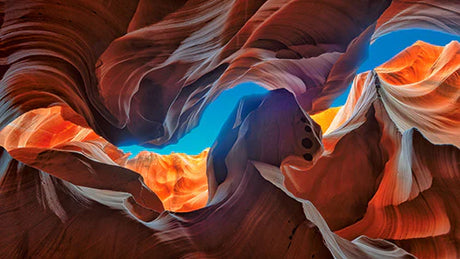 Stunning orange geological formations in Antelope Canyon wall art, highlighting erosion and badlands