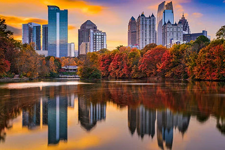 Atlanta skyline reflection in water, featuring skyscrapers and high-rise buildings