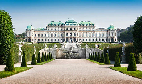 Official residence and landmark mansion in Austria, featuring landscaped garden and hedge shrubs