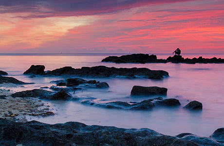 Bermuda collection wall art featuring a sunset over the water with afterglow and dusky clouds.