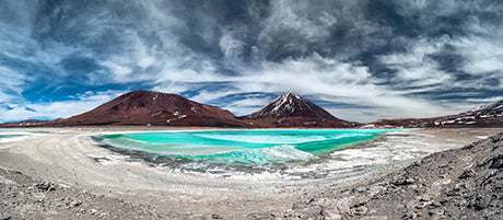Bolivian wall art featuring blue mountains, coastal landforms, beach, and glacial lake reflection