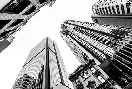 Monochrome photograph of high-rise commercial buildings in Brisbane's urban metropolitan area.
