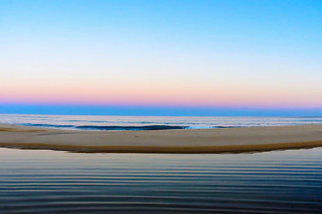 Dusk view of Cabo San Lucas beach with blue ocean and coastal landforms wall art