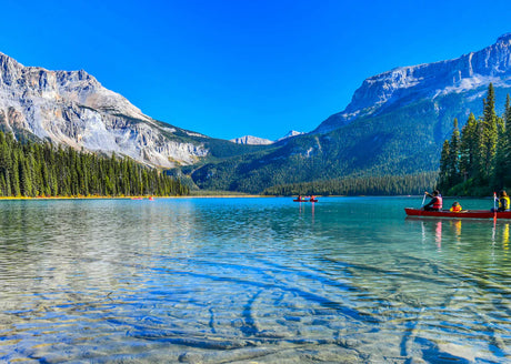 Stunning natural landscape wall art featuring a serene Canadian lake surrounded by green wilderness and mountain reflections