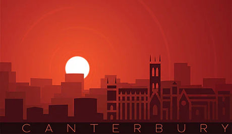 Canterbury collection wall art featuring a silhouette skyline and tower under a vibrant orange and red morning sky at dusk.