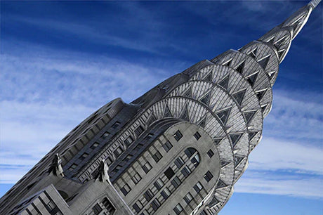 Daytime view of the iconic Chrysler Building skyscraper in the metropolitan cityscape