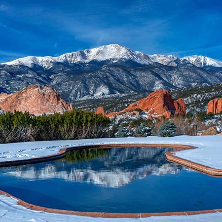 Snowy Pikes Peak and Garden of the Gods reflected in a pool near Colorado Springs – majestic mountain wall art for cozy home or elegant office décor.