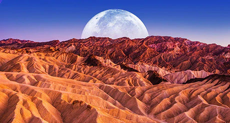 Full moon over Badlands terrain in Death Valley wall art from the 'Death Valley' collection