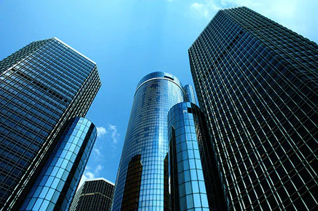 Daytime photograph of high-rise commercial buildings in metropolitan Detroit, showcasing urban beauty.