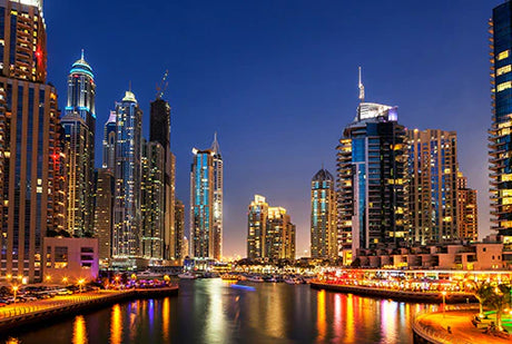 Dubai cityscape at night, featuring high-rise buildings and skyscrapers in metropolitan area