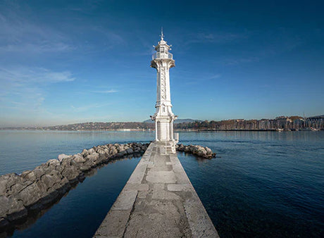 Blue sky and water horizon view with tower, part of Geneva Wall Art Collection