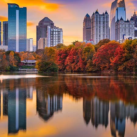 Atlanta skyline at sunset with autumn trees and city reflections on Piedmont Park lake – colorful Georgia wall art for modern home or office décor.