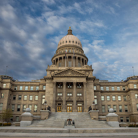 Idaho State Capitol building in Boise under dramatic cloudy sky – historic architecture wall art for classic home, civic space, or professional office décor.