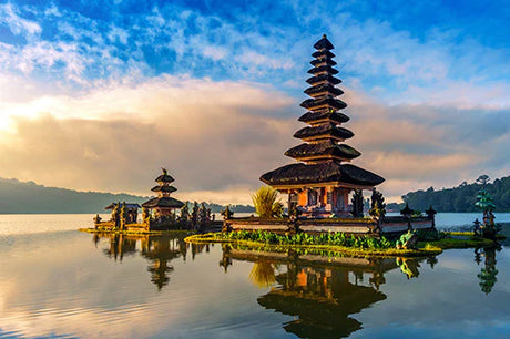 Indonesian wall art featuring a Pagoda temple, Chinese and Japanese architecture, reflected in a tranquil lake under a cloudy sky.