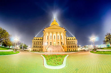Evening view of classical Kansas courthouse with dome and finials, local government seat