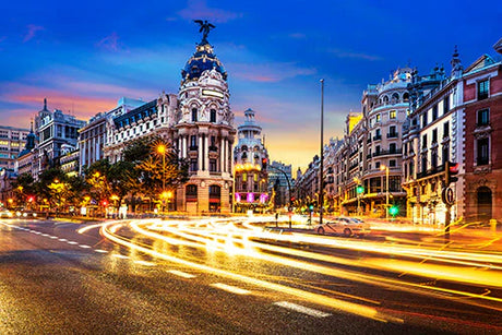 Madrid cityscape wall art featuring a bustling urban road, landmark attractions, and metropolitan street lights