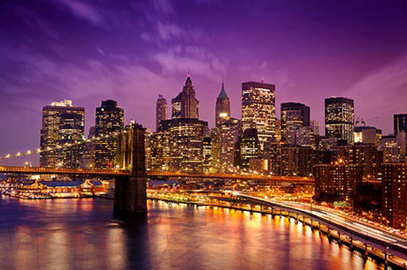 Manhattan collection wall art featuring skyscrapers, a bridge, and cityscape in a metropolitan night setting.
