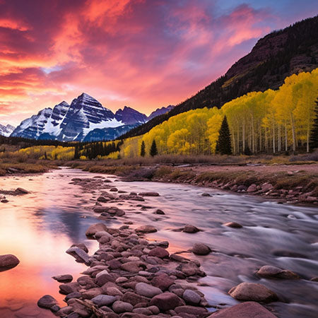 Maroon Bells mountains at sunrise with vibrant sky, fall foliage, and alpine river in Colorado – breathtaking landscape wall art for cozy home or office décor.