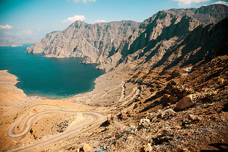 Middle Eastern wall art featuring a breathtaking mountain range, rocky terrain, and scenic valley landscape.