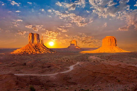 Monument Valley wall art featuring desert landscape with geological rock formations under a cloud-filled sky