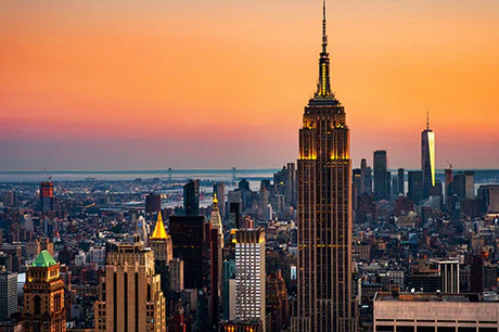 Dusk in New York City with skyscrapers, high-rise buildings, and urban metropolitan area wall art