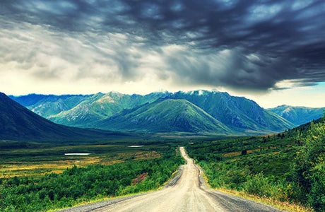 Wall art featuring green highland ecoregion, mountainous landscape, and road in Northwest Territories