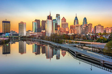 Daytime view of Philadelphia's urban skyline with skyscrapers reflecting on the city's water resources