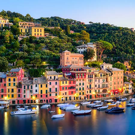 Scenic Portofino harbor at sunset with colorful Italian buildings and luxury boats – coastal wall art for elegant home or office décor.