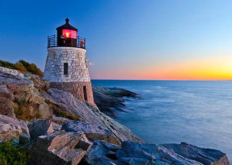 Blue lighthouse wall art featuring Rhode Island's rocky coast and oceanic landforms