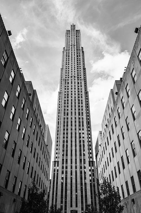 Black and white monochrome photograph of high-rise buildings in Rockefeller Center, urban metropolitan area.