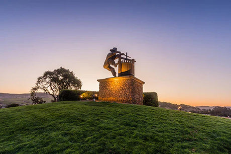 Bronze sculpture on pedestal with musical instrument in a morning landscape, Sonoma wall art collection