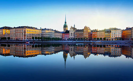 Stockholm collection wall art featuring a landmark building's reflection in a city waterway