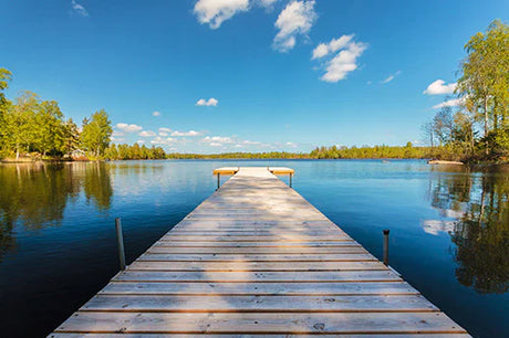 Stunning natural landscape of Sweden with blue waterway, dock, and pier wall art