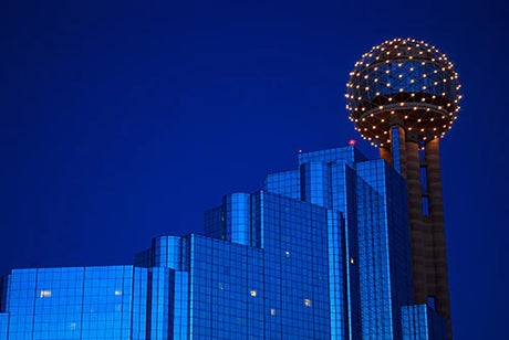 Blue night skyline of Texas metropolis with high-rise commercial skyscrapers showcasing symmetry