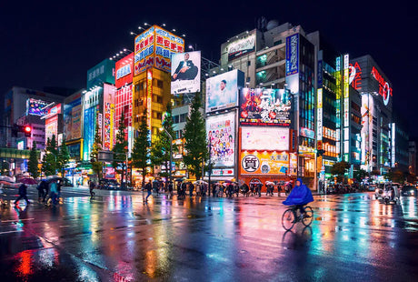 Nighttime view of Tokyo metropolis featuring urban street lighting and electricity