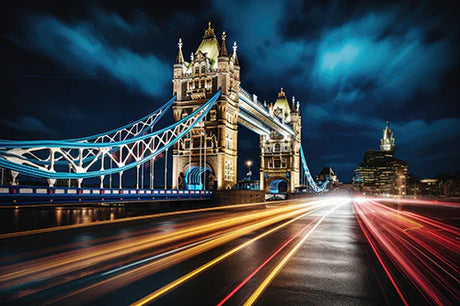 Night view of lit-up Tower Bridge, a suspension and cable-stayed bridge, in metropolitan area