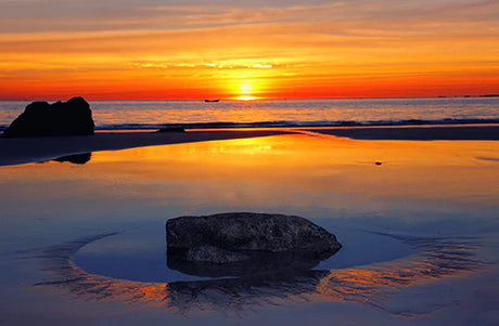 Stunning Turks and Caicos wall art featuring a beach sunset with orange afterglow on the horizon