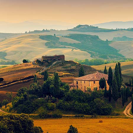 Rolling hills of Tuscany with rustic villas, cypress trees, and golden sunset light – classic Italian countryside wall art for elegant home or office décor.