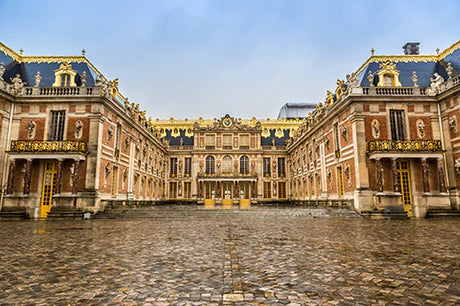 Symmetrical view of the classical architecture of Versailles Palace, a landmark tourist attraction and official residence.