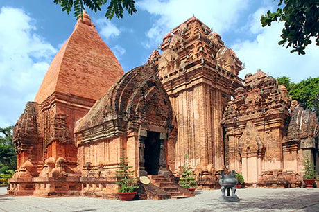 Stone carved Hindu Temple, a historic tourist attraction in Vietnam, featuring ancient shrines and finials.