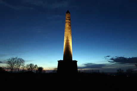 Wellington Collection wall art featuring a national monument, obelisk tower at dusk with morning sunlight.