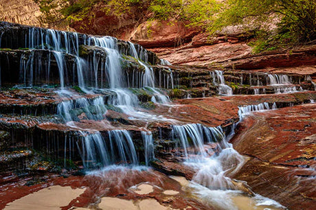 Zion National Park waterfall image showcasing natural landscape, rocks, and flowing stream