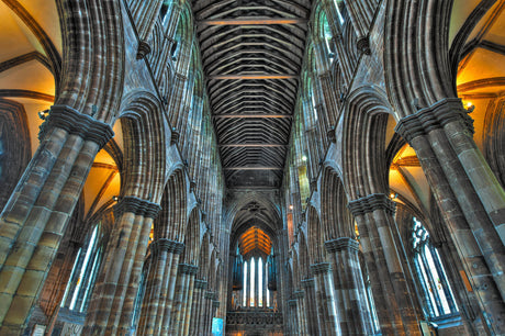 Gothic-style church cathedral with medieval architecture, stained glass, and sunlight in holy chapel