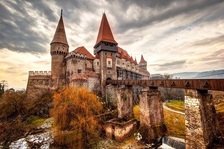 Medieval Romanian castle with historic architecture, spires, and turrets as wall art