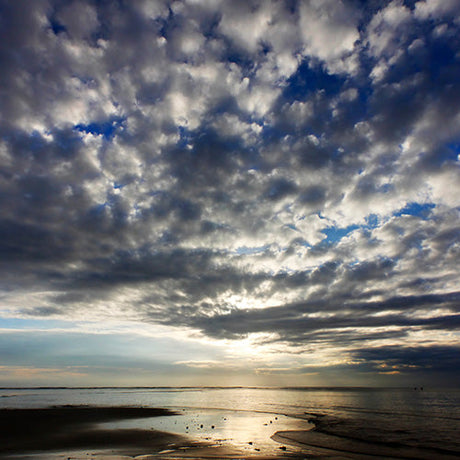Urban skyscapes wall art photography of dramatic cloudscape over calm shoreline at sunset, fine art sky print for modern city decor