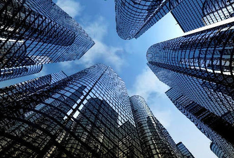 Blue skyscraper high-rise building in urban metropolitan area during daytime