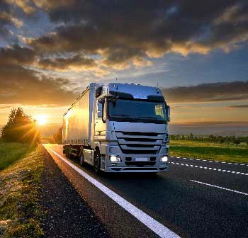 Commercial truck driving on highway, showcasing automotive exterior for truck-themed wall art